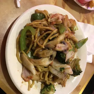 a plate of noodles and vegetables