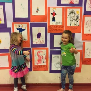 Friends sharing their artwork.