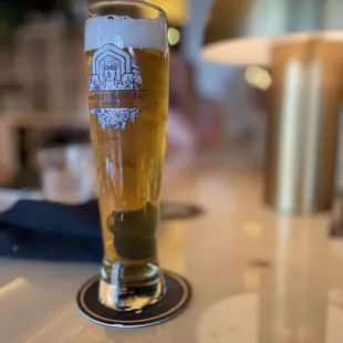 a glass of beer on a table