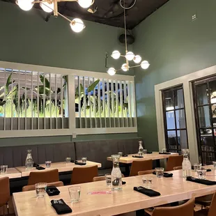 a dining room with tables and chairs