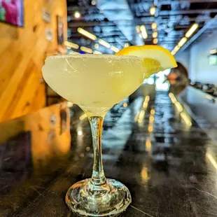 Lemon drop mixed drink cocktail in a martini glass.