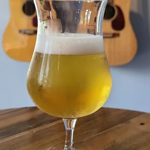 a glass of beer on a table