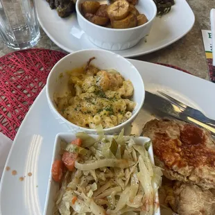 Curry goat, White Rice, and Fried Plantain   Turkey chops, Steam Cabbage N Carrots, Mac N Cheese