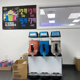 three beverage dispensers on display