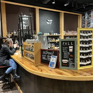 a woman sitting at the bar