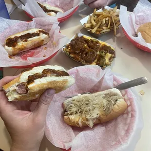 Chili cheese dogs with onions, kraut dog, loaded fries with jalapeños, plain fries and a cheeseburger