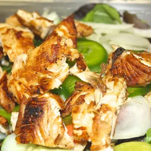 a salad with chicken and vegetables