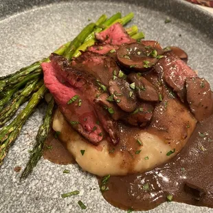 NY strip with truffle mash, citrus asparagus, and mushroom demi glacé
