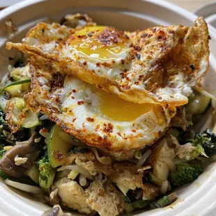 MYOB: Thai basil, tofu, brown rice, broccoli, kale, sprouts, zucchini, add crispy egg and mushrooms.