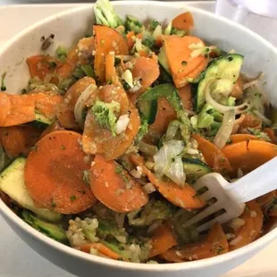 a bowl of vegetables on a table