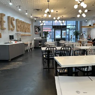 a dining area with tables and chairs