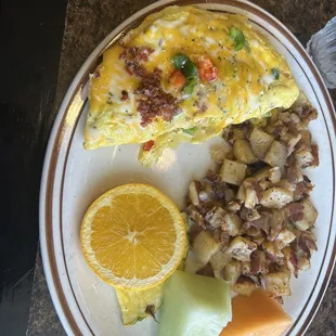 Garden Omelette with no tomatoes, add bacon, Homestyle fries, and Fruit