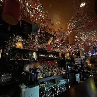 the interior of a bar decorated for christmas
