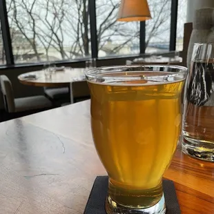 a glass of beer on a table