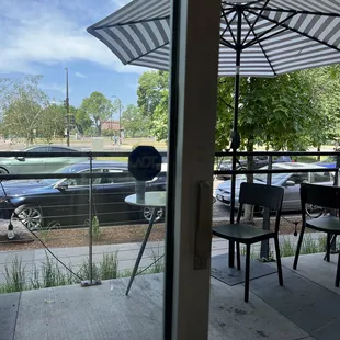 a view of a parking lot through a glass door