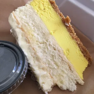 a piece of cake and a container