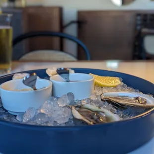 a platter of oysters on ice