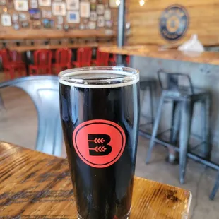 a pint of beer on a table