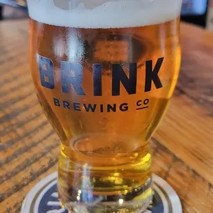 a glass of beer on a table