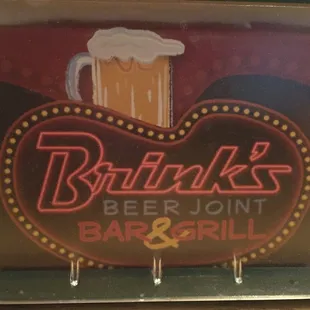 a neon sign for a bar and grill