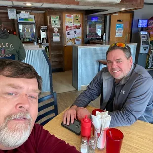 two men sitting at a table