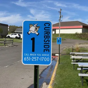 a blue sign with a cow on it