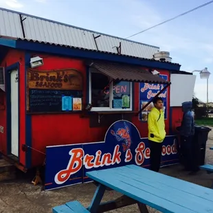 a man standing in front of a booth