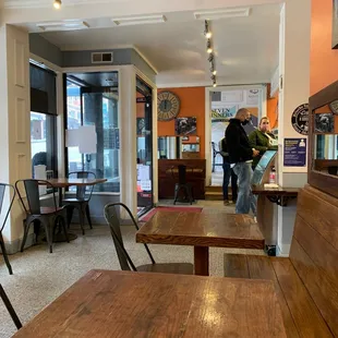 two people standing in the dining room