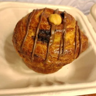 a pastry in a styrofoam container