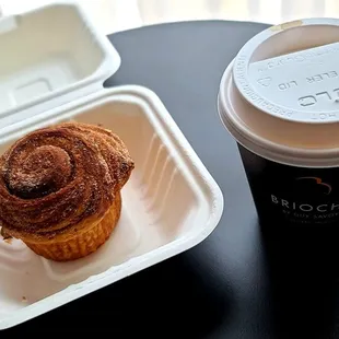 a cup of coffee and a pastry