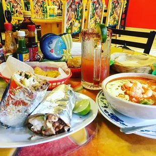 a bowl of soup and burritos