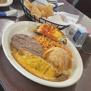 Crunchy taco and beef enchiladas combo served with refried beans and rice. VERY GOOD!