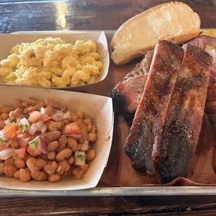Texas Trinity; Brisket, Ribs, jalapeno cheddar sausage, brisket beans and Mac n&apos; cheese