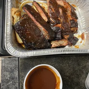 Half slab of ribs  and sauce