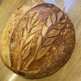 Country Sourdough boule of classic white sourdough. Beautiful craftsmanship, amazing chewy and crusty texture and fantastic flavor!