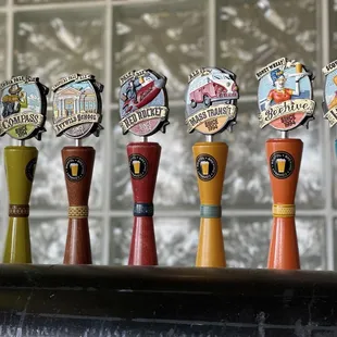 a row of beer taps