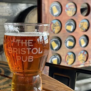 a glass of beer on a table