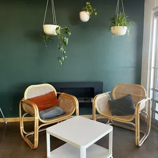 two chairs and a table in a living room