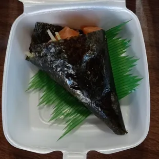 Salmon, avocado, cucumber, and masago handroll