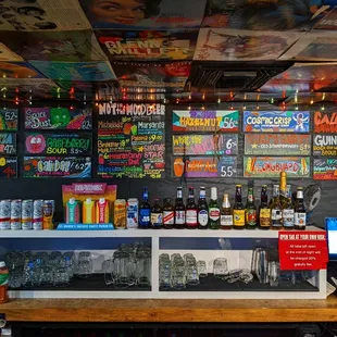 a bar with a variety of drinks