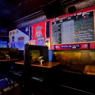 a bar with a menu on the wall