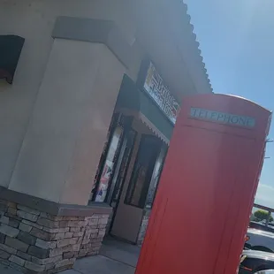 The front of the store has a telephone box and flags. Can&apos;t miss it!