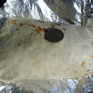 A JUMBO beef burrito (see quarter for scale) - very good - yum!