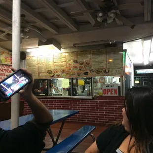 Sitting at the benches waiting for food