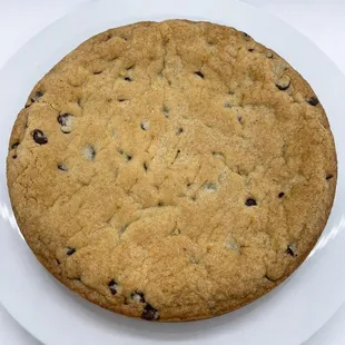 a chocolate chip cookie on a white plate