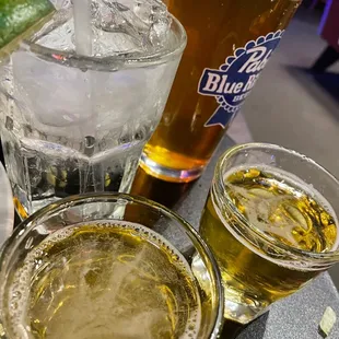 a glass of beer and two glasses of beer