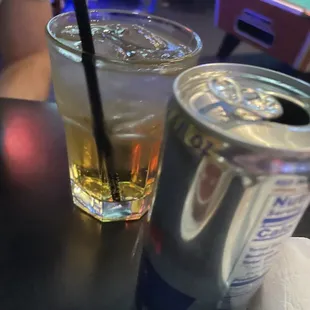 a beer and a drink on a table