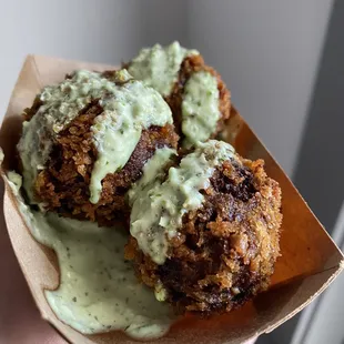 a hand holding a piece of food