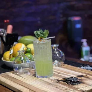a cocktail on a cutting board