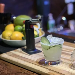 a margarita with cucumber and lime